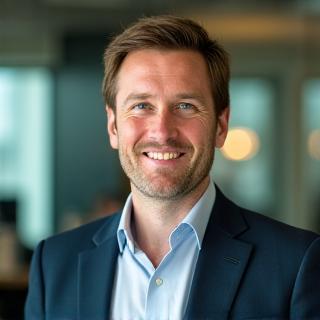 Liam O'Connell, Founder and CEO of ThistleMoor Events, smiling professionally.